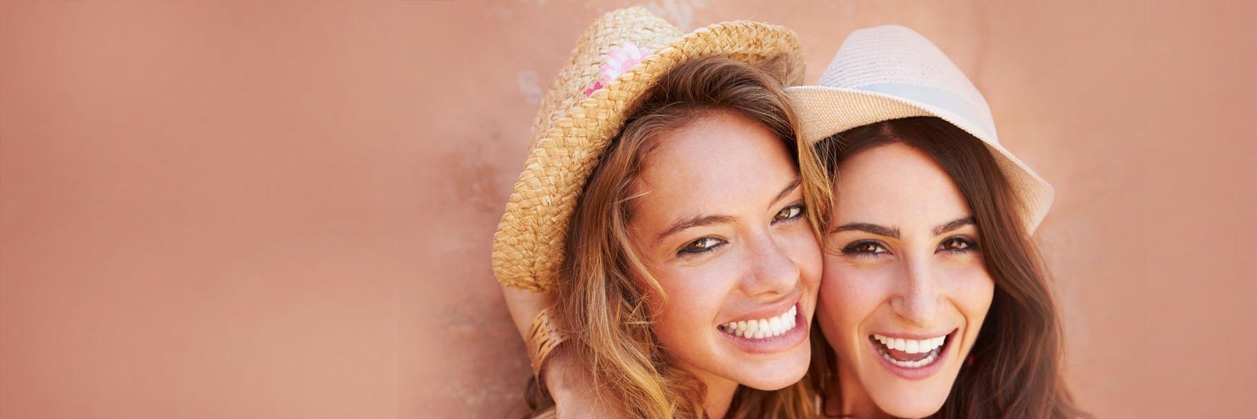 Friends posing together wearing invisalign clear braces st cloud fl
